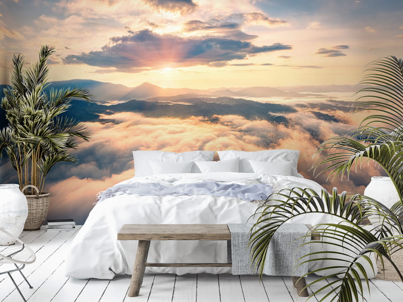 Fototapeta Świt ponad chmurami we wnętrzu sypialni