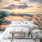 Miniatura fototapety Świt ponad chmurami we wnętrzu sypialni