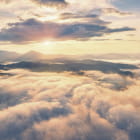 Miniatura fototapety Świt ponad chmurami