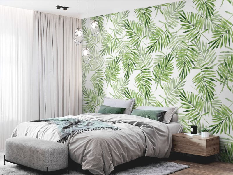 Fototapeta Jasnozielone liście palmowe we wnętrzu sypialni