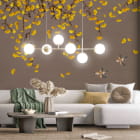 Miniatura fototapety Złote liście i ptaki we wnętrzu salonu